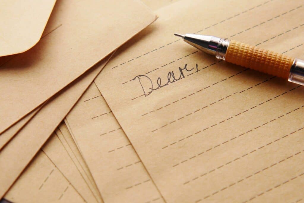 a pen sitting on top of a letter